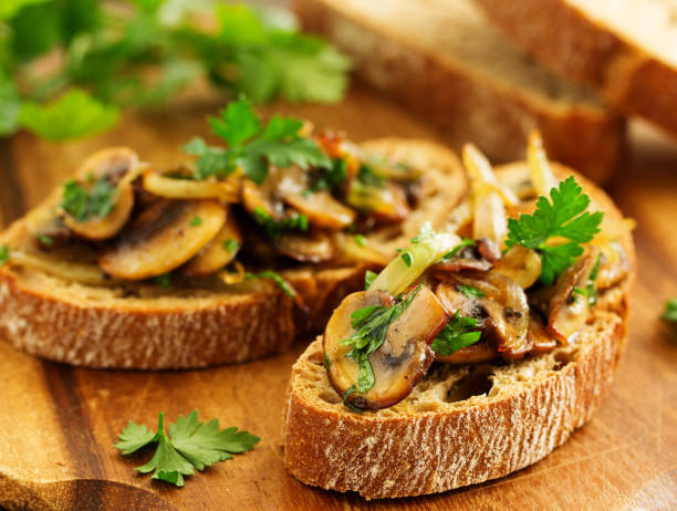 istock Bruschetta with fried mushrooms with onions and parsley. 1183120982