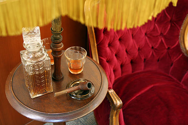 Scotch, Pipe, and velvet chair  time period stock pictures, royalty-free photos & images