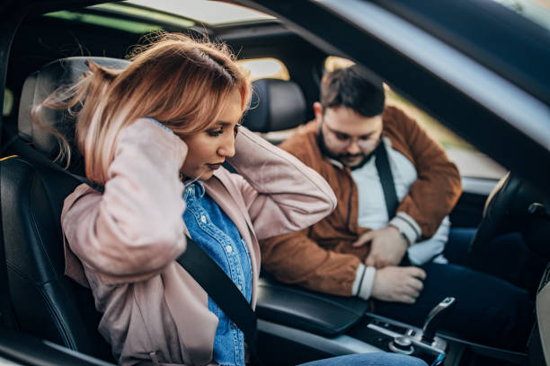 istock Two friends fastening their seatbelts 1183124367