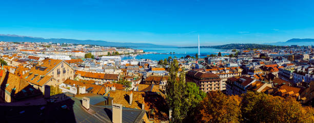 Panoramic view from the tower of Geneva Cathedral to the city center and the lake with a fountain. Panoramic view from the height of Geneva Cathedral on the city center in the fall in Switzerland. switzerland zurich architecture church stock pictures, royalty-free photos & images