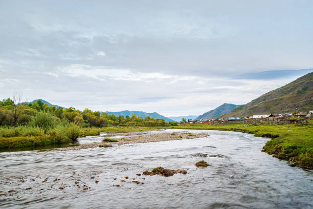 istock Morning landscape with a river in a mountain valley 1183124569