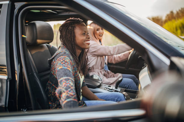 istock Young women driving in the car 1183128231