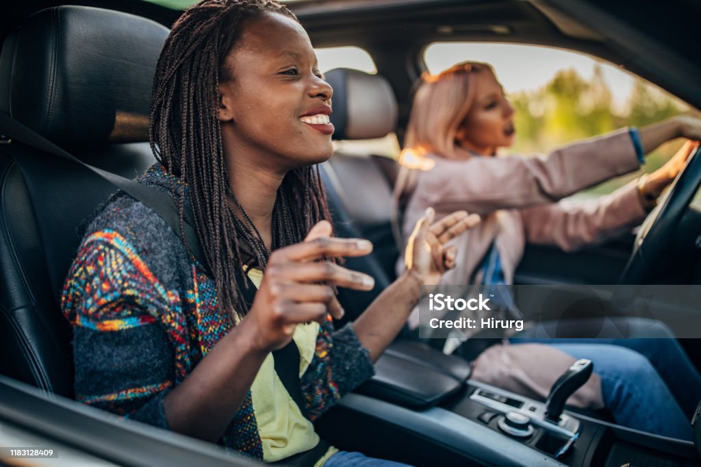 young women driving in the car Two young women driving in the car Car Stock Photo