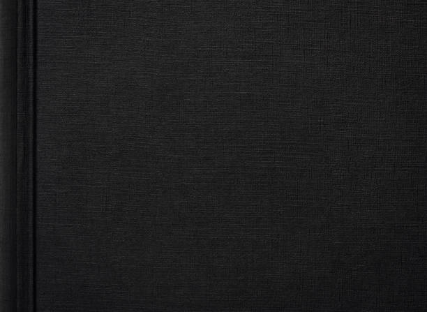 hochauflösendes foto eines schwarzen buchumschlags - canvas textured linen textile stock-fotos und bilder