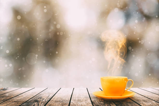istock hot coffee on the table on a winter background 1183129274