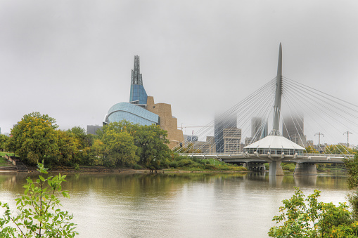The Museum for Human Rights and Bridge in mist in Winnipeg
