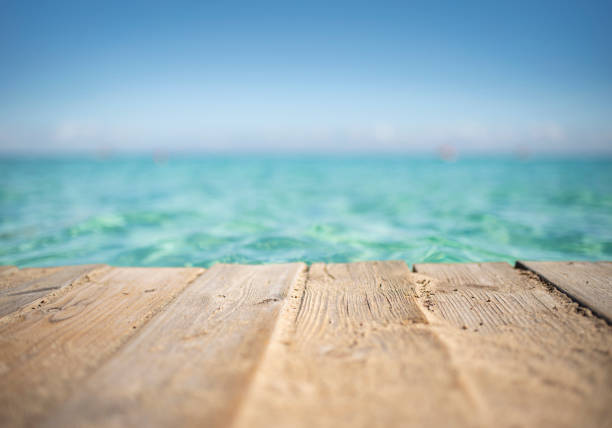 Paper Boat sailing on turquoise Water