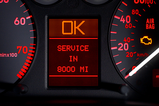 Close-up of a digital car odometer in dashboard