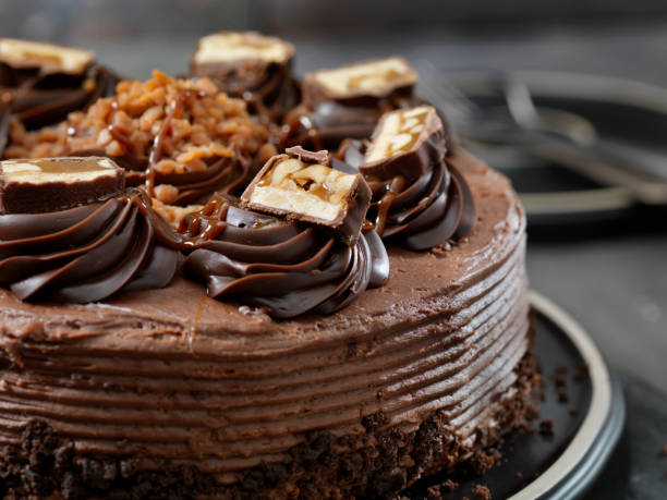 istock Caramel, Butter Toffee Crunch Chocolate Cake with Candy Bar Pieces 1183135030