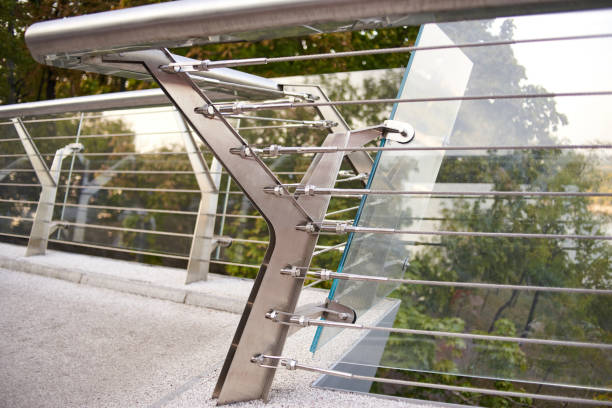 istock A bridge over a river fenced by a glass fence. 1183135304