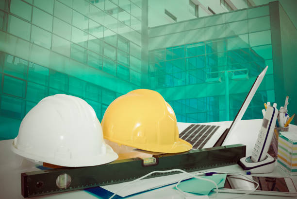 istock Hardhats on large plant background 1183135458