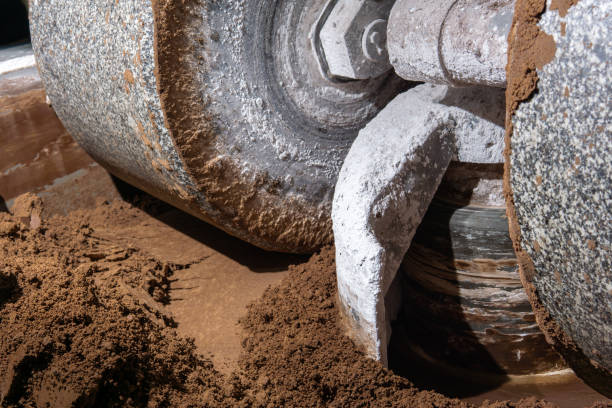 millstone of industrial melanger grind cocoa in the process of making chocolate millstone of industrial melanger grind and mix cocoa and other ingredients in the process of making chocolate, close-up old candy store stock pictures, royalty-free photos & images