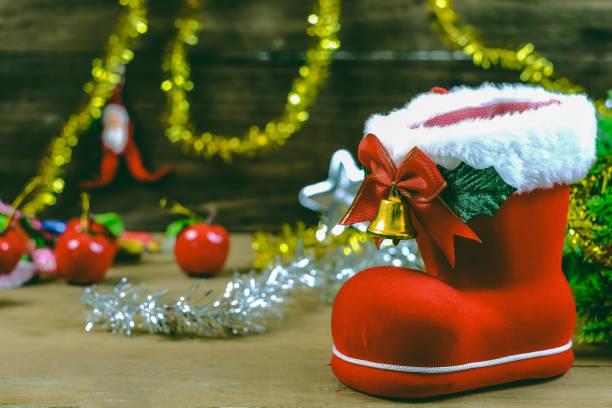 istock Red boot christmas or Santa's shoe on rustic wooden table,Christmas background. 1183138903