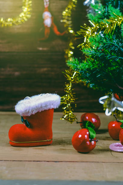 istock Red boot christmas or Santa's shoe on rustic wooden table,Christmas background. 1183138931