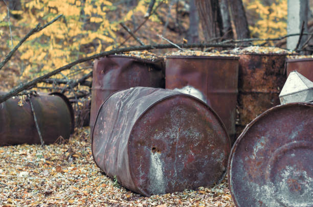 old barrels of chemical waste with chlorine in chernobyl close up - tailings container environment pollution imagens e fotografias de stock