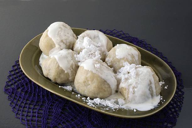 istock plum dumplings with cream and sugar 118314284