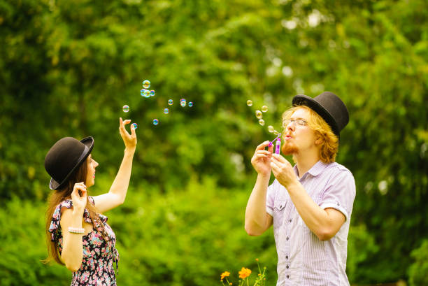 istock Couple blowing bubbles outdoor 1183144807