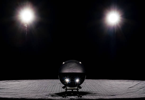 Crystal Ball on Table with Black Background with Lights