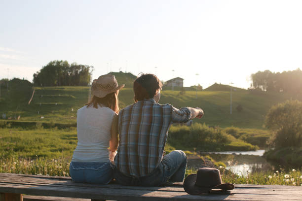 istock Cute couple on a walk by the countryside 1183148938