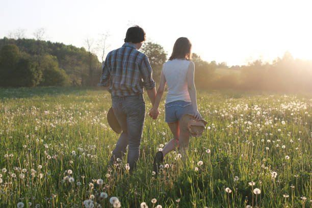 istock Cute couple on a walk by the countryside 1183149082