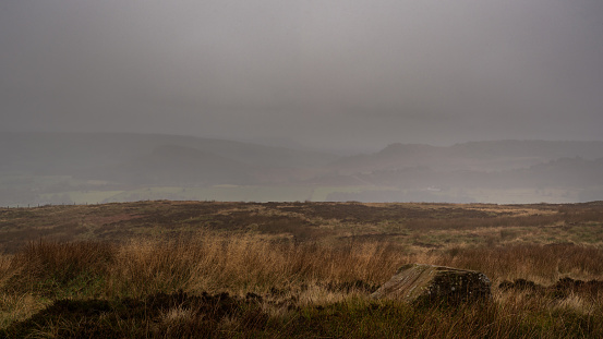 A misty panoramic view of The Roaches, Hen Cloud and Ramshaw Rocks in the Peak District National Park.