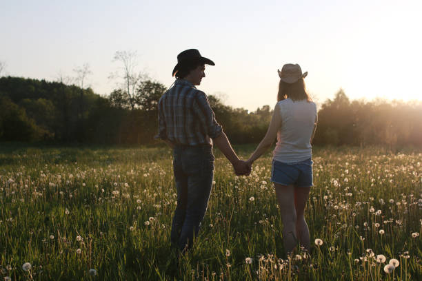 istock Cute couple on a walk by the countryside 1183149100