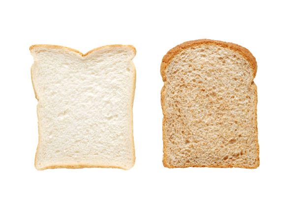 istock Two slices of bread, one white ,one brown whole wheat 1183149548