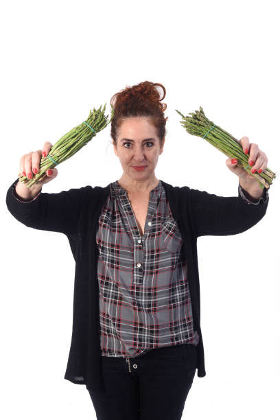 istock woman with white background and food 1183150799