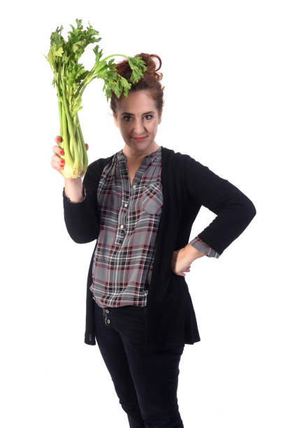 istock woman with white background and food 1183150904