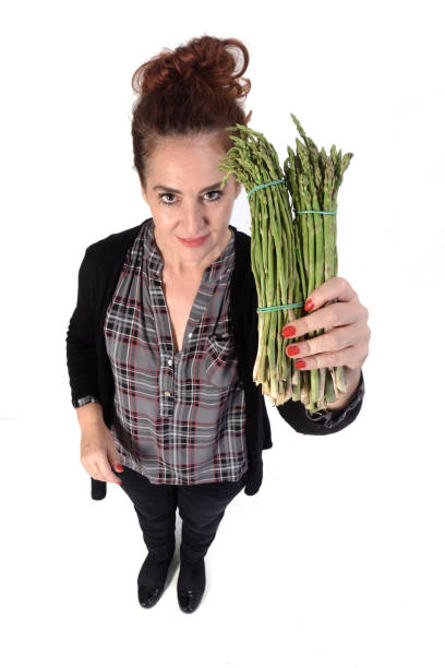 istock woman with white background and food 1183150949