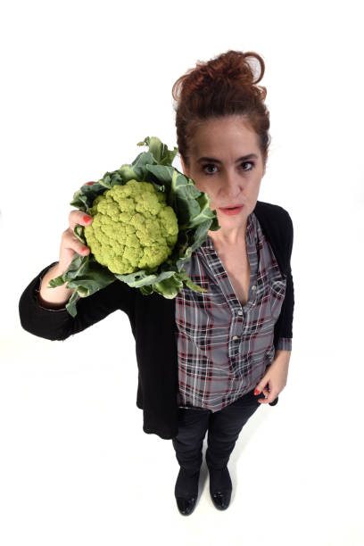 istock woman with white background and food 1183151497