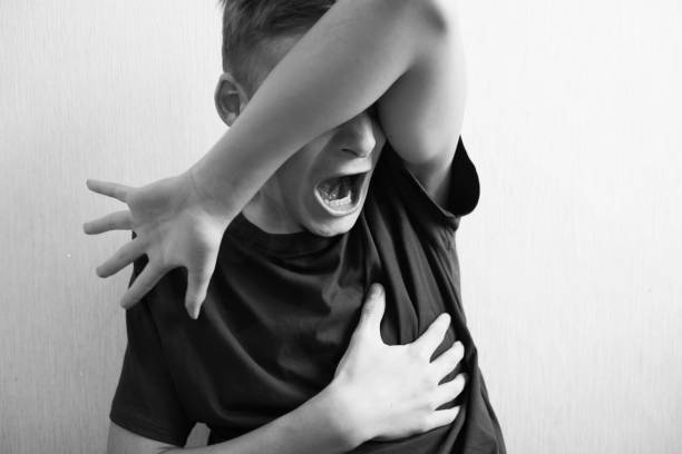 istock The guy holds his hand by the chest 1183151684