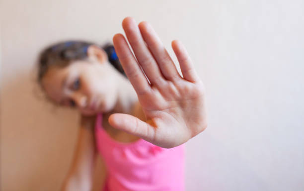 istock Little girl is protected by an open palm 1183151854
