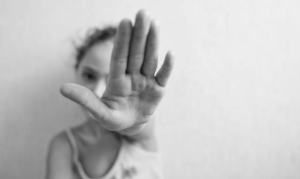 istock Little girl is protected by an open palm 1183152005