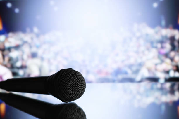 istock The microphone on the stage in front of the hall. Performance on stage. 1183152263