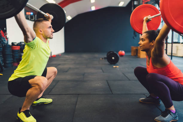 istock gym workout - weightlifting in gym concept 1183153803
