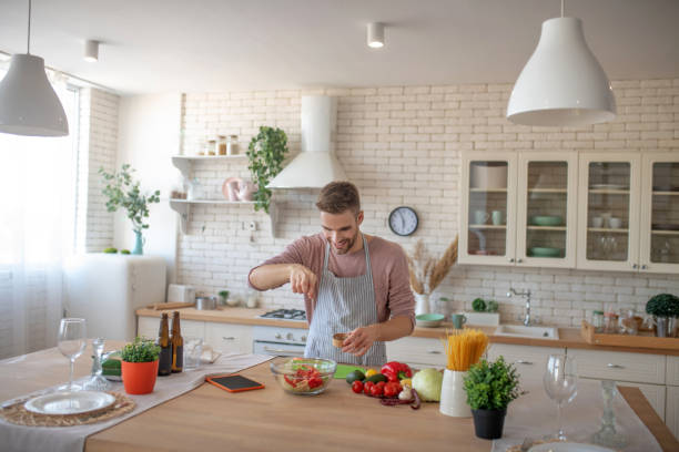 istock Man enjoying cooking time in his spacious modern kitchen 1183154064