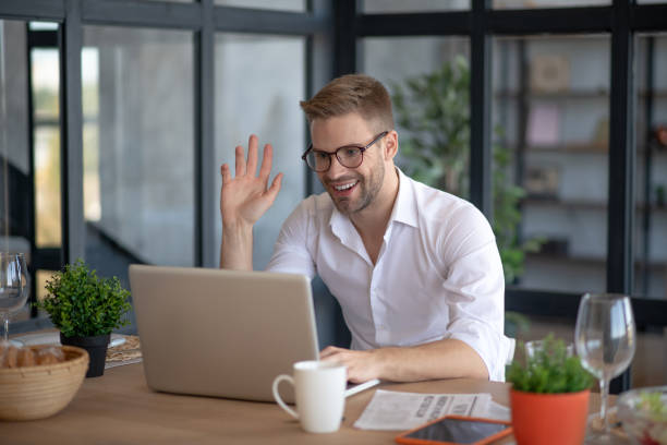istock Bearded handsome man spending morning in living room 1183154113