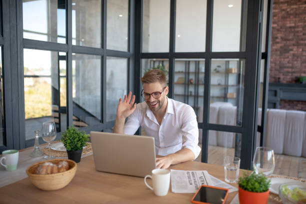 istock Man having video chat with girlfriend in the morning 1183154119