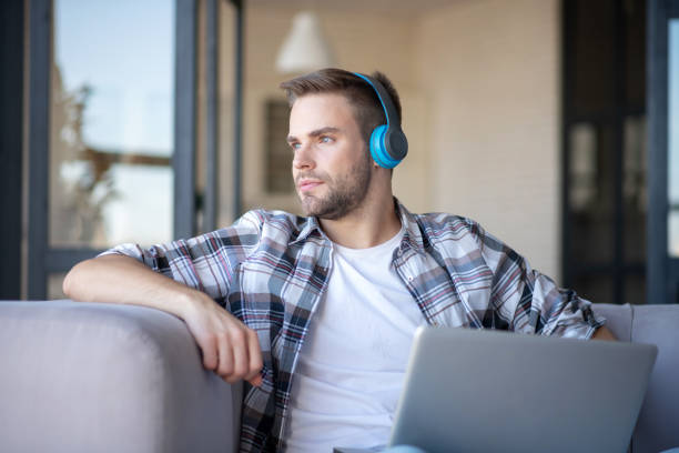 istock Handsome blue-eyed freelancer feeling good working at home 1183154148