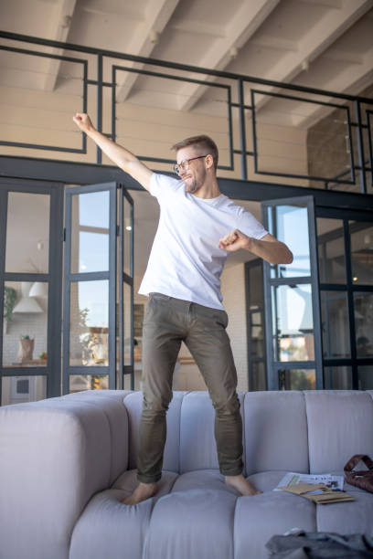 istock Businessman feeling positive while having rest at home 1183154290