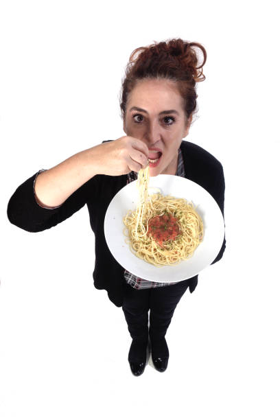 woman with pasta on white background