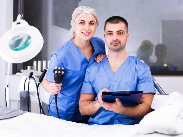 istock Two confident beauticians working in clinic 1183159962