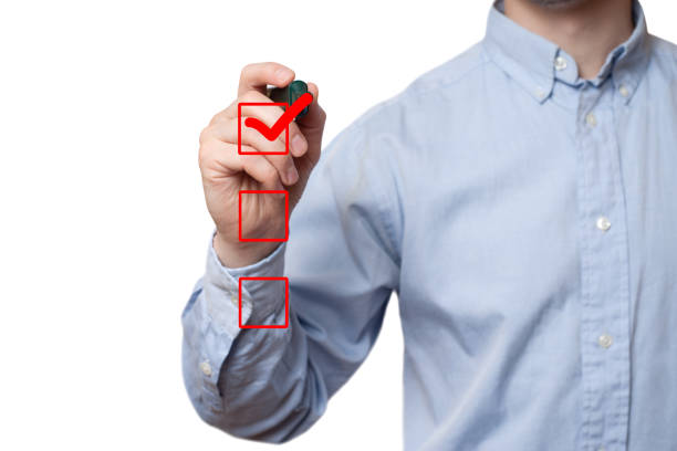 istock businessman checking mark checklist marker Isolated on  white background 1183160010