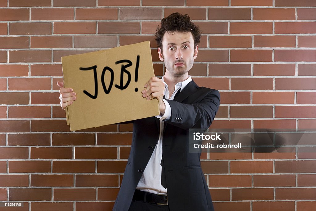 Geschäftsmann pleads mit Schild "Sie Arbeit" - Lizenzfrei Abhängigkeit Stock-Foto