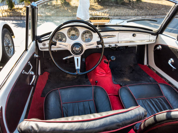 interior design and dashboard of beautiful vintage white car model alfa romeo giulietta spider 1300 - collectors car dashboard odometer mode of transport imagens e fotografias de stock