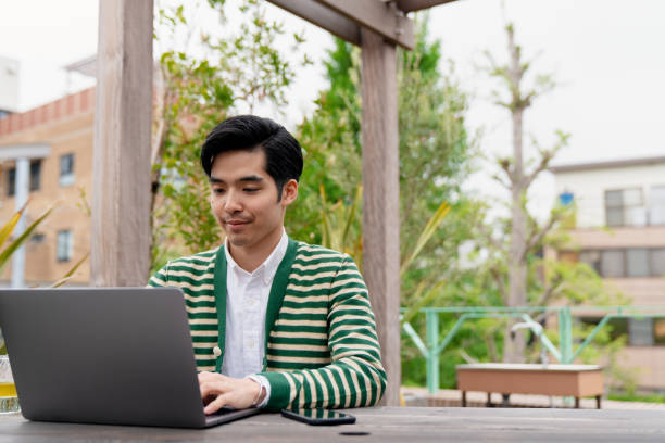 istock Confident young man working outdoors 1183163134