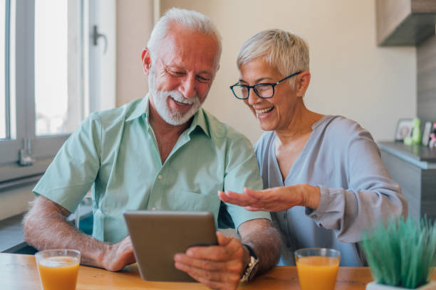 istock Elderly couple checking their credit card 1183164860