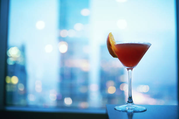 istock Cocktail glasses on the windowsill by the glass 1183165063