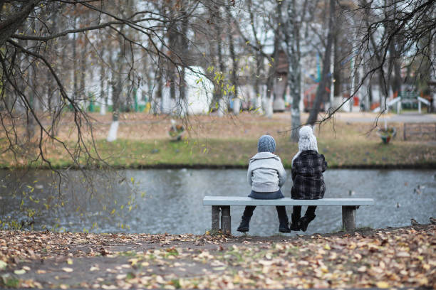 istock Children walk in the autumn park 1183169969
